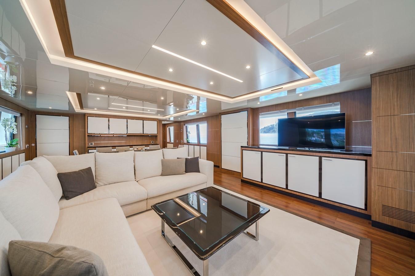 a living room with a couch and a tv aboard FIORENTE Yacht for Sale