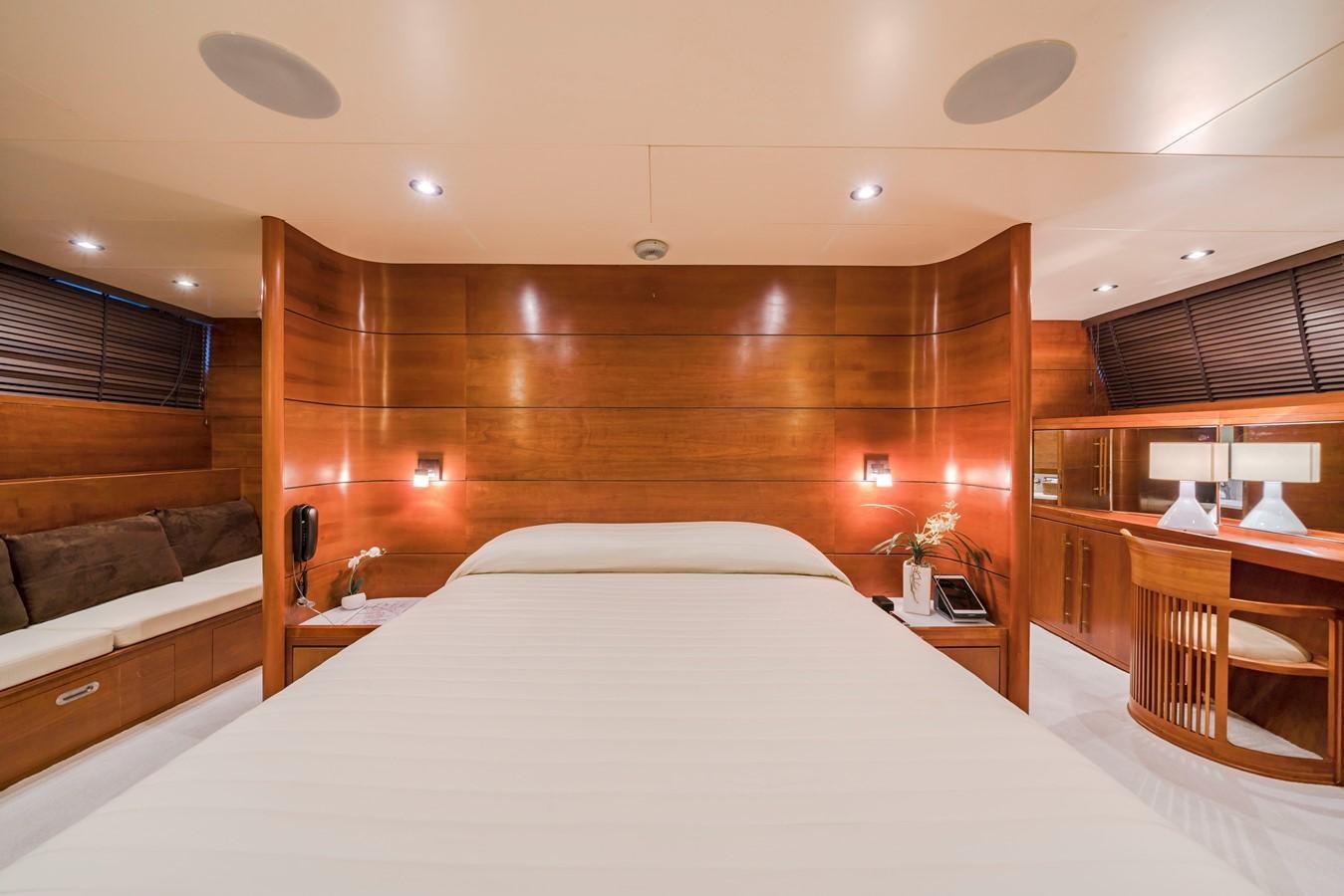 a bedroom with a bed and a couch aboard FIORENTE Yacht for Sale