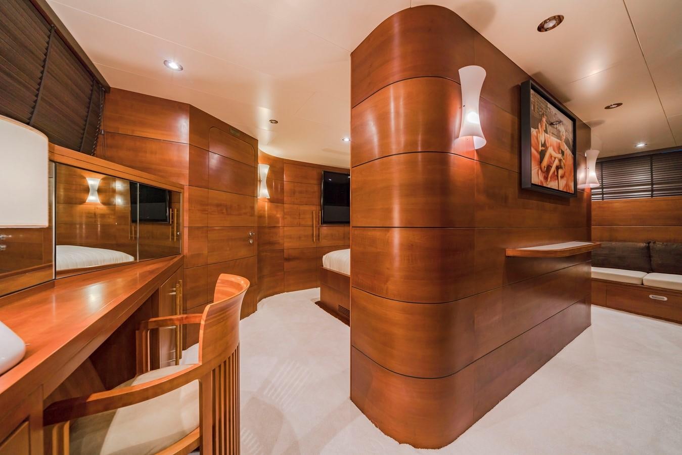 a room with wooden furniture aboard FIORENTE Yacht for Sale