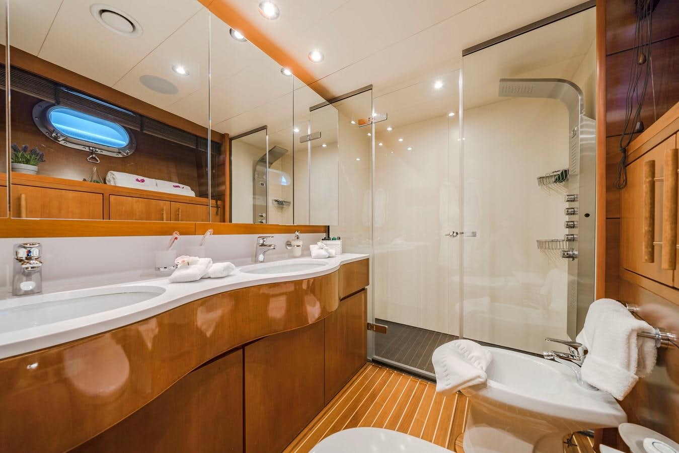 a bathroom with a large mirror aboard FIORENTE Yacht for Sale