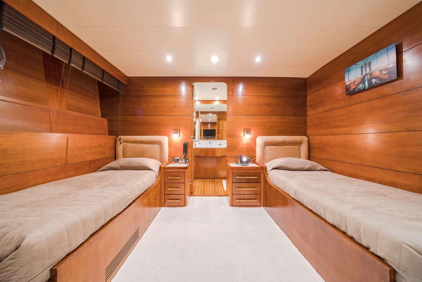a room with a bed and a tv aboard FIORENTE Yacht for Sale