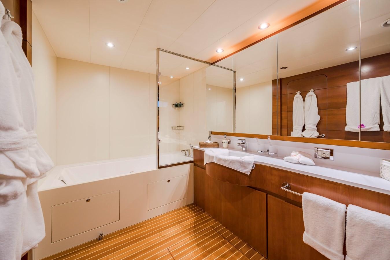 a bathroom with a large mirror aboard FIORENTE Yacht for Sale