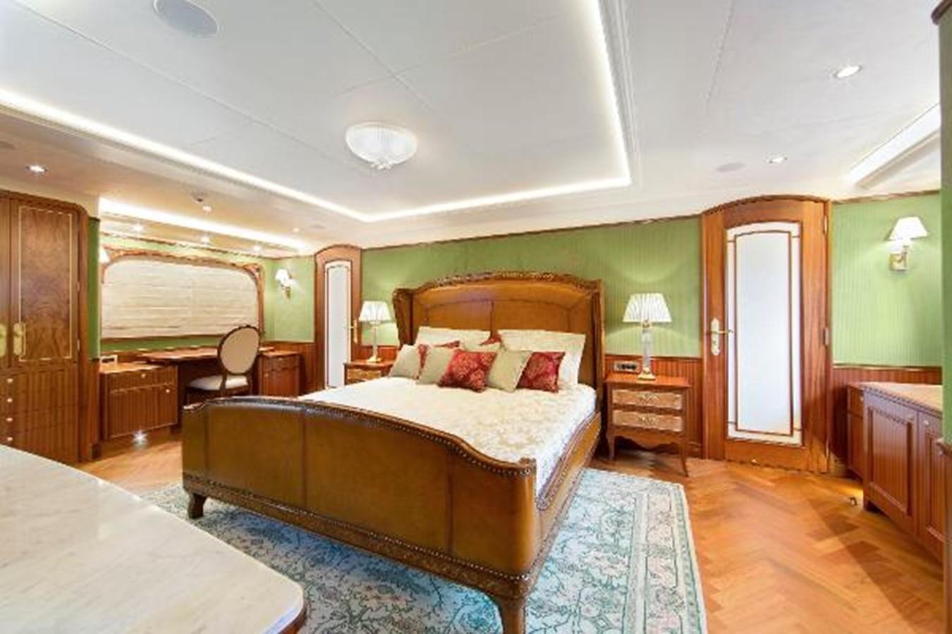 a bedroom with a bed and a desk aboard 121FT EXPLORER 37 Yacht for Sale
