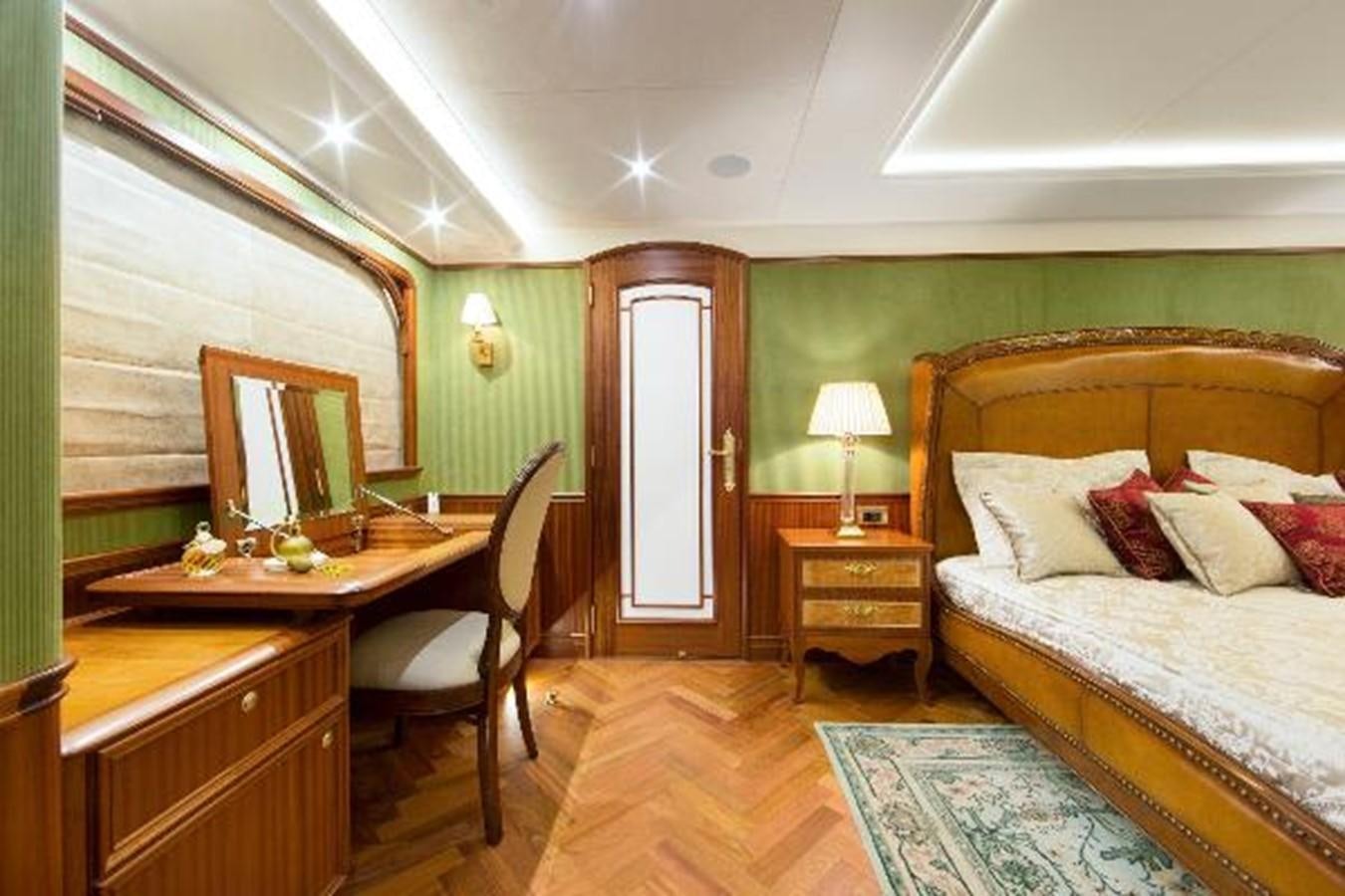 a bedroom with a bed and desk aboard 121FT EXPLORER 37 Yacht for Sale