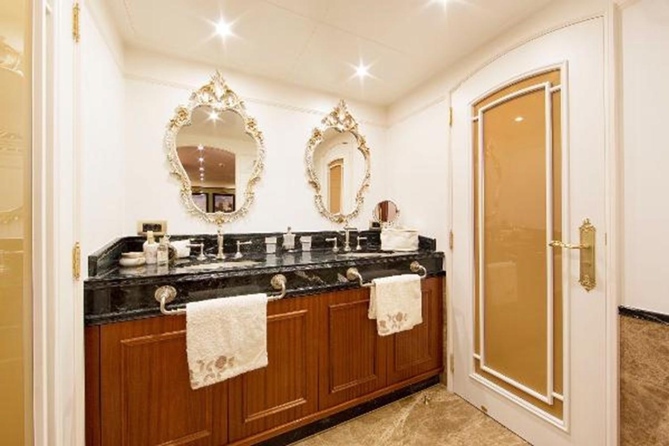 a bathroom with a sink and a mirror aboard 121FT EXPLORER 37 Yacht for Sale