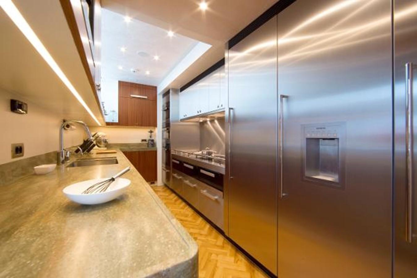 a kitchen with stainless steel appliances aboard 121FT EXPLORER 37 Yacht for Sale