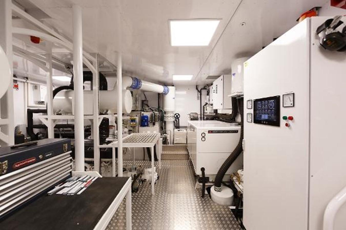 a room with white machines aboard 121FT EXPLORER 37 Yacht for Sale