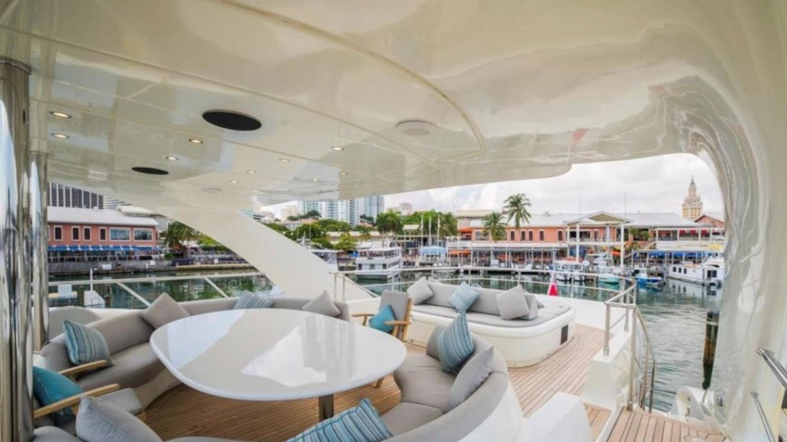 a room with a table and chairs aboard HAPPY HOUR Yacht for Sale
