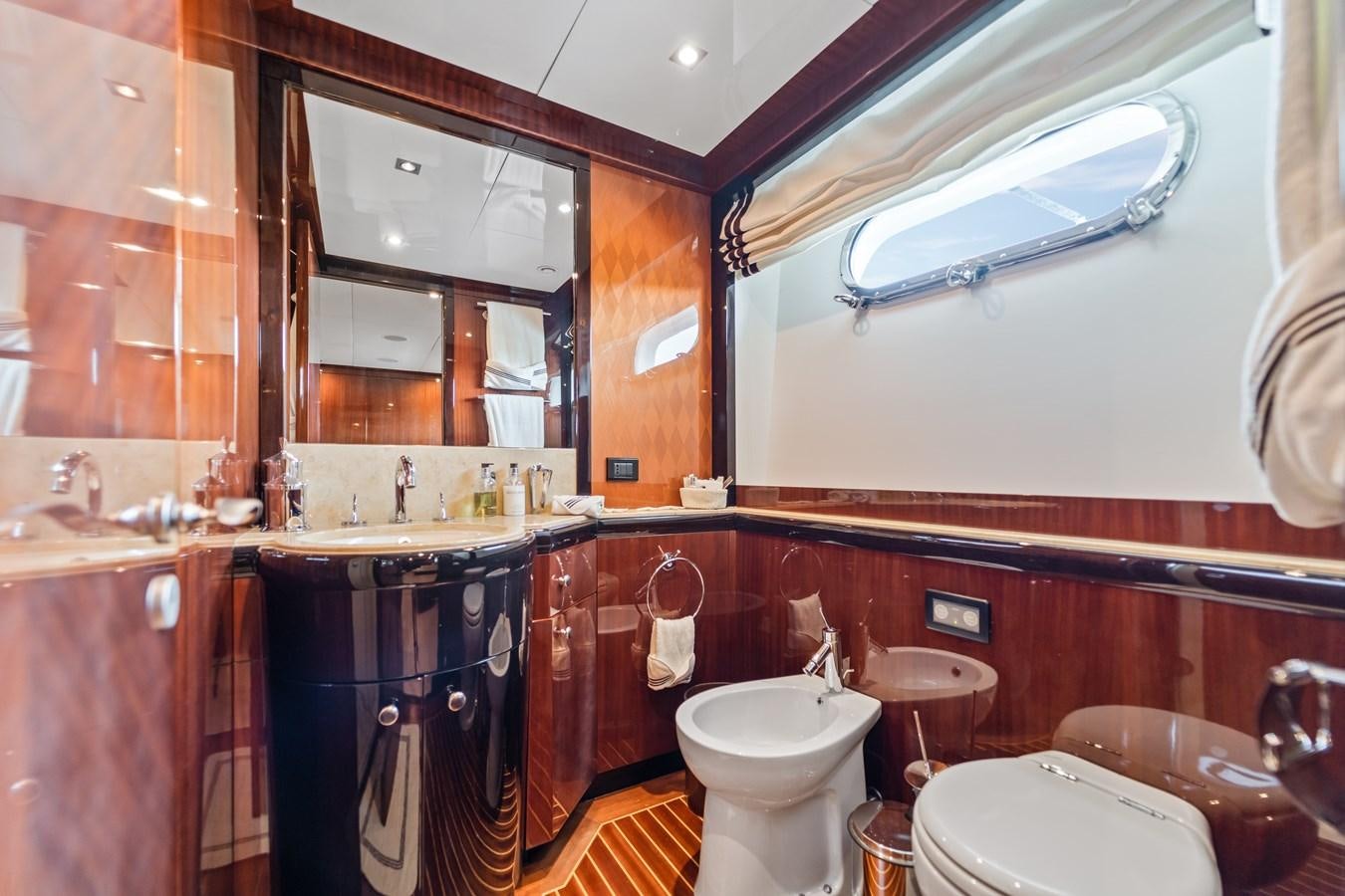 a bathroom with a sink and a toilet aboard HAPPY HOUR Yacht for Sale