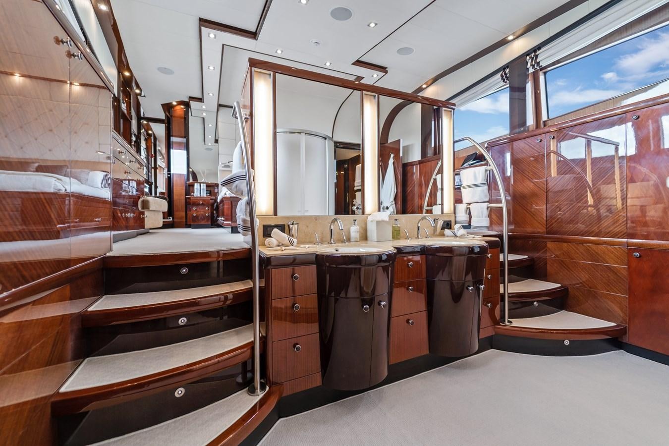 a room with a large mirror and cabinets aboard HAPPY HOUR Yacht for Sale