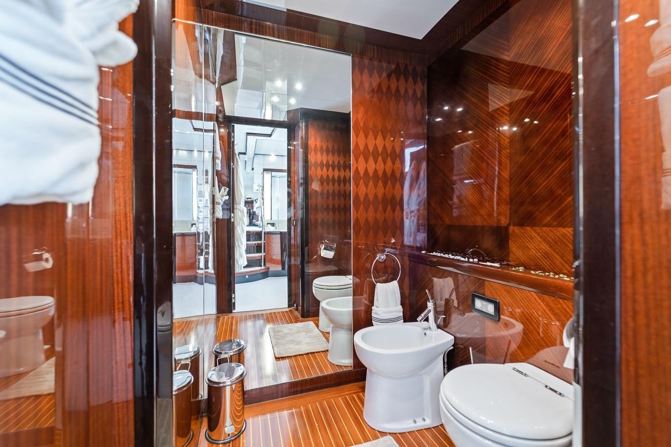 a bathroom with a glass shower aboard HAPPY HOUR Yacht for Sale