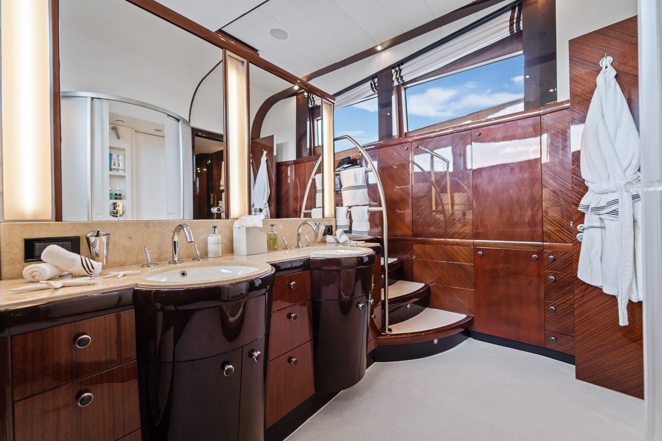 a bathroom with a large mirror aboard HAPPY HOUR Yacht for Sale