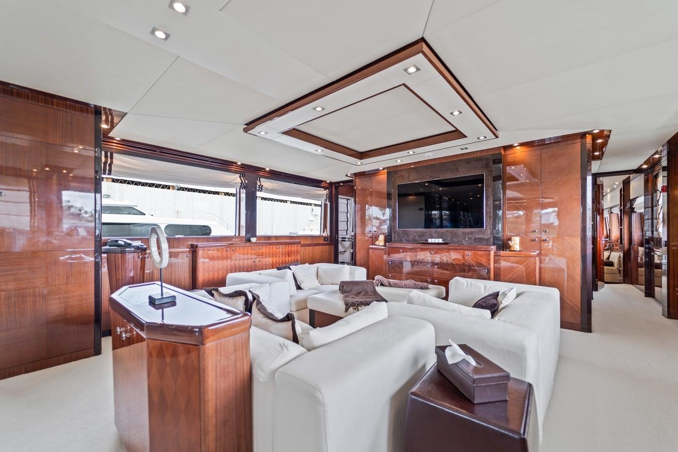a living room with a large glass window aboard HAPPY HOUR Yacht for Sale
