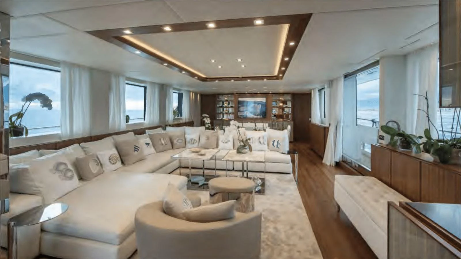 a large living room with a large bed and a large window aboard TOUTE SWEET Yacht for Sale