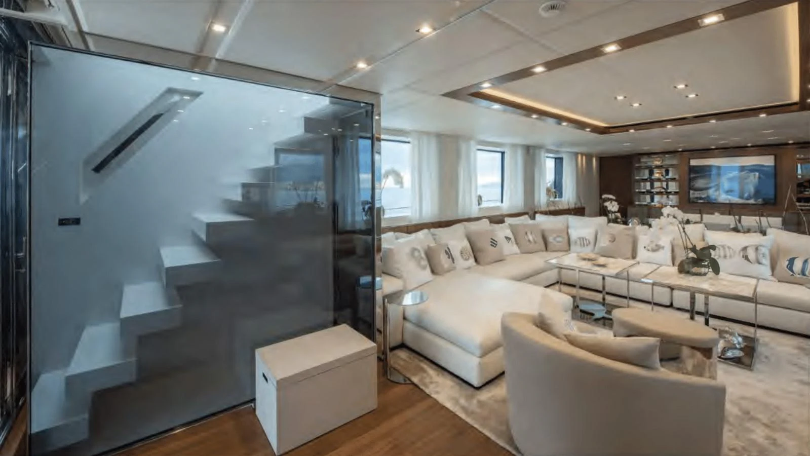 a living room with a large screen aboard TOUTE SWEET Yacht for Sale