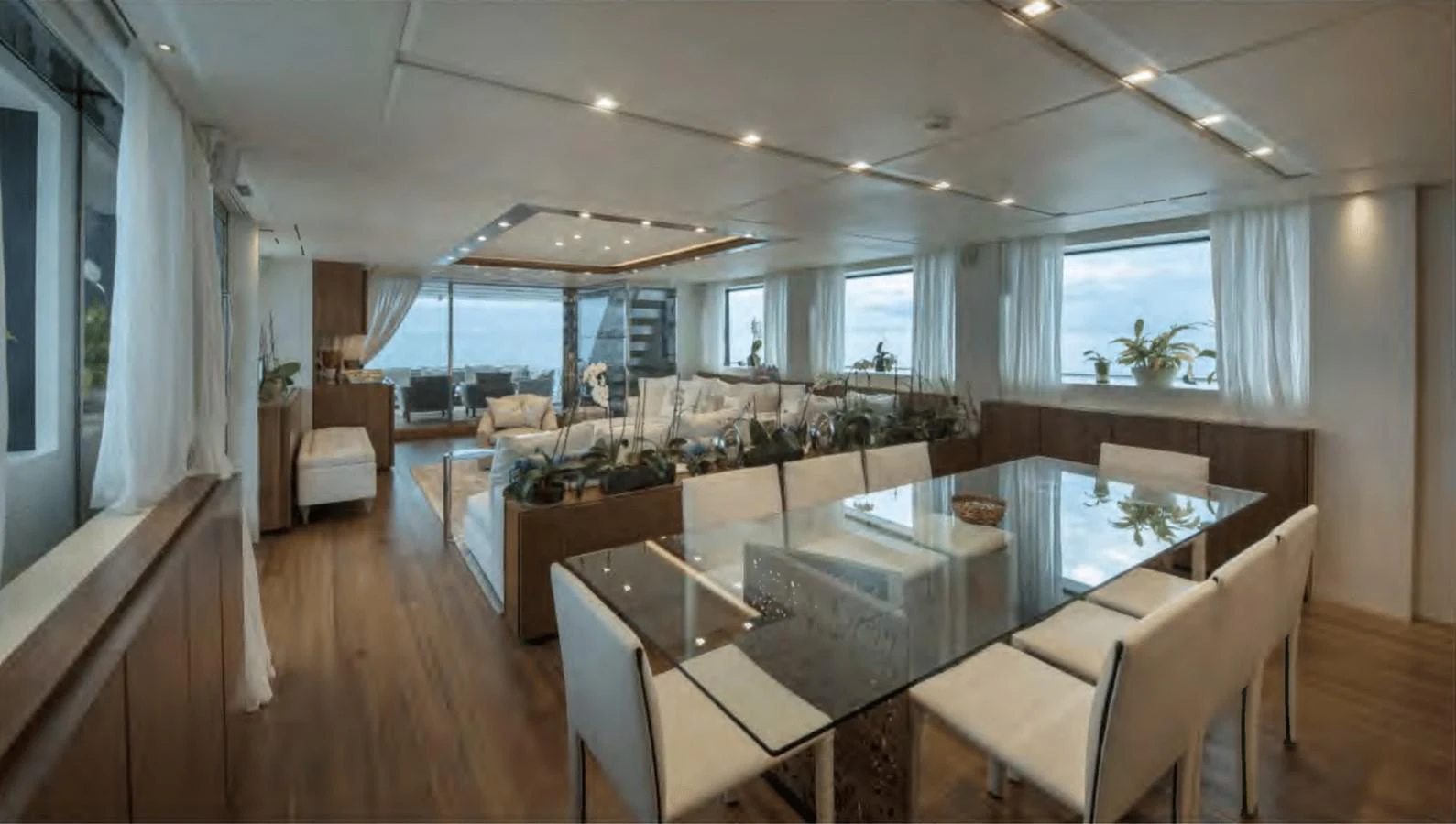 a large living room with a large window aboard TOUTE SWEET Yacht for Sale