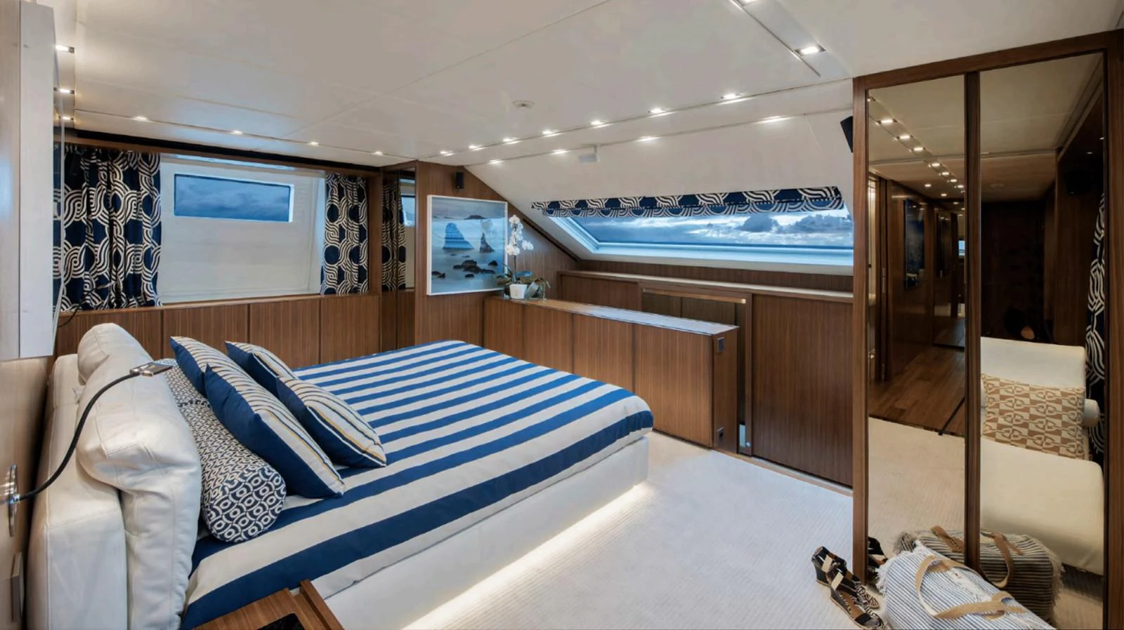a room with a bed and a view of the ocean aboard TOUTE SWEET Yacht for Sale