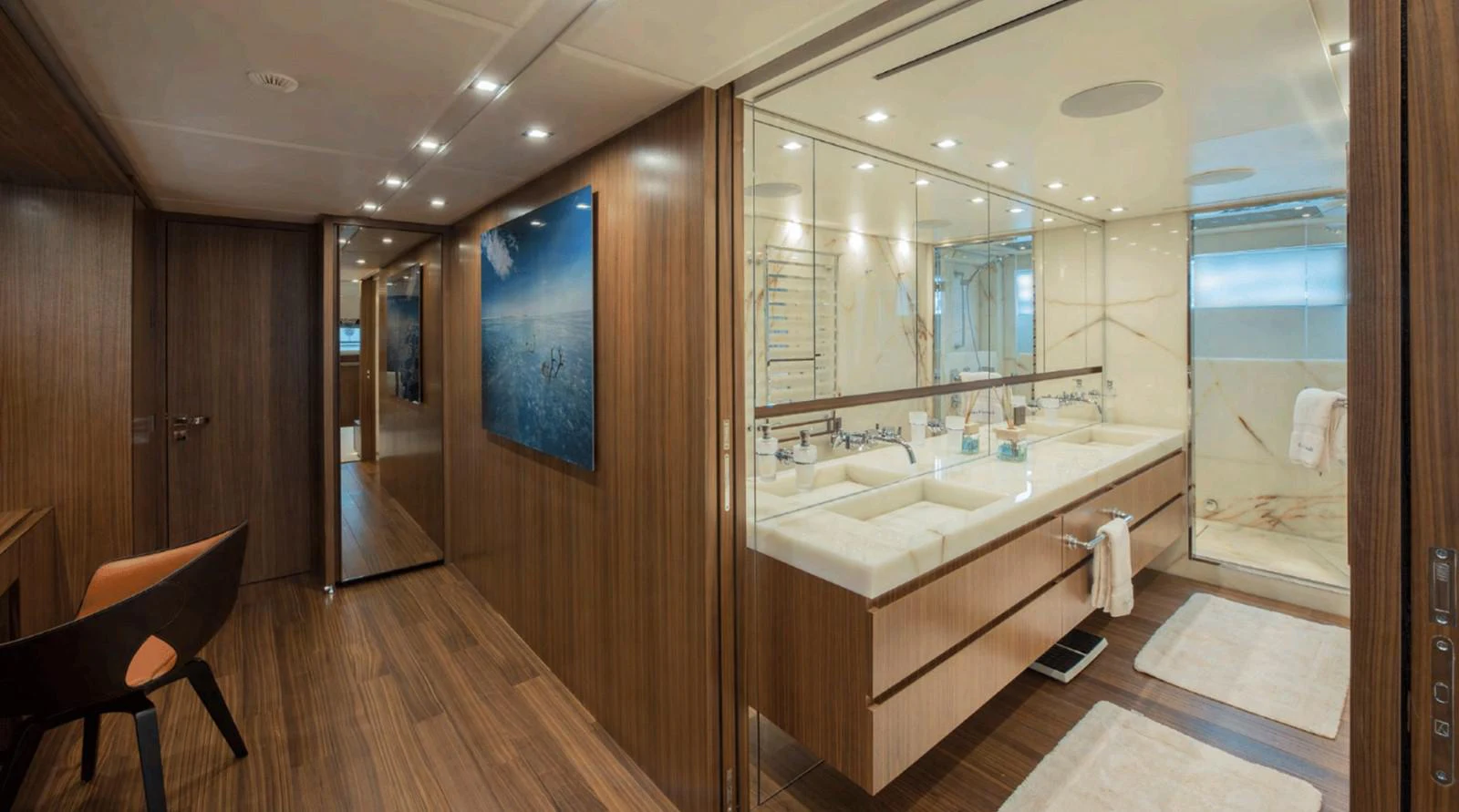 a bathroom with a large mirror aboard TOUTE SWEET Yacht for Sale