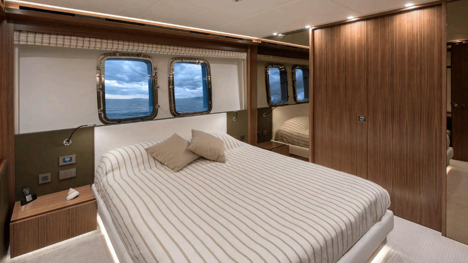 a room with a bed and a window aboard TOUTE SWEET Yacht for Sale