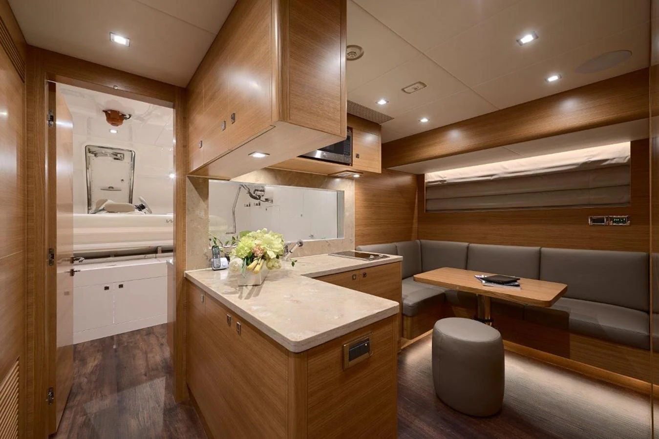 a kitchen with wooden cabinets aboard RP120 (NEW BOAT SPEC) Yacht for Sale