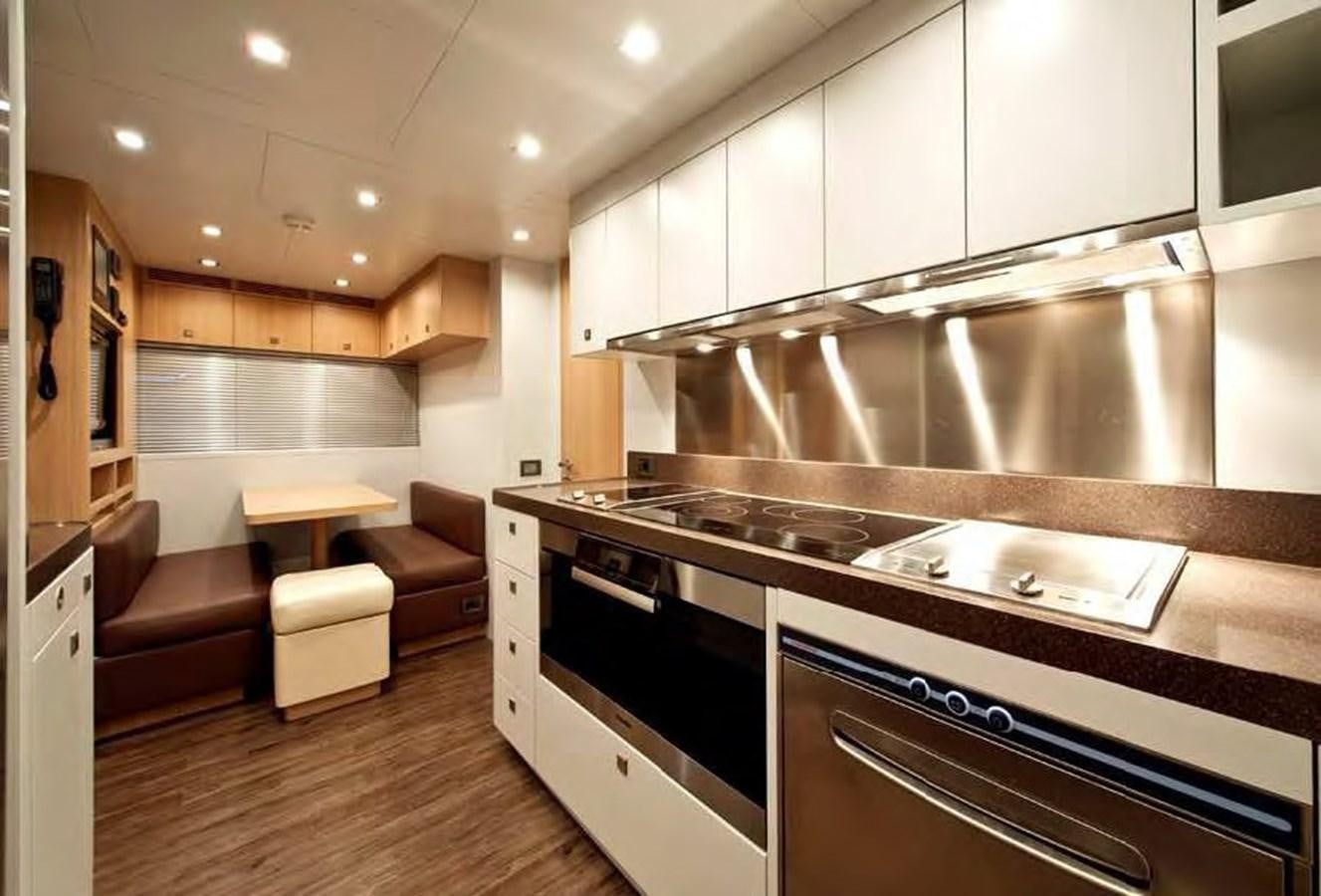 a kitchen with a large island aboard MUSA Yacht for Sale