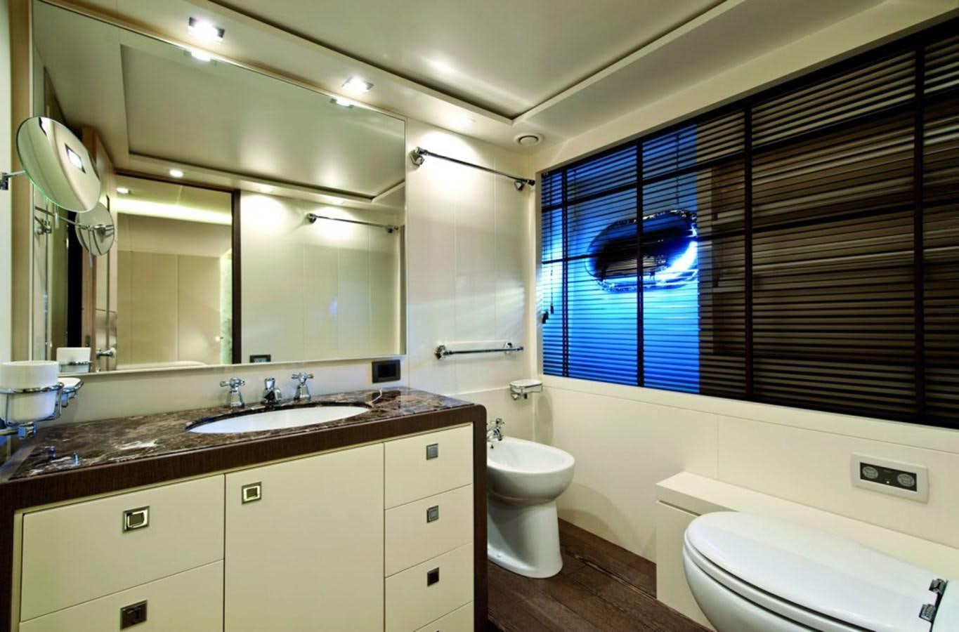 a bathroom with a large mirror aboard MUSA Yacht for Sale