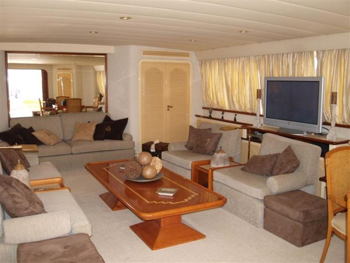 a living room with a tv and sofas aboard PARADIS Yacht for Sale