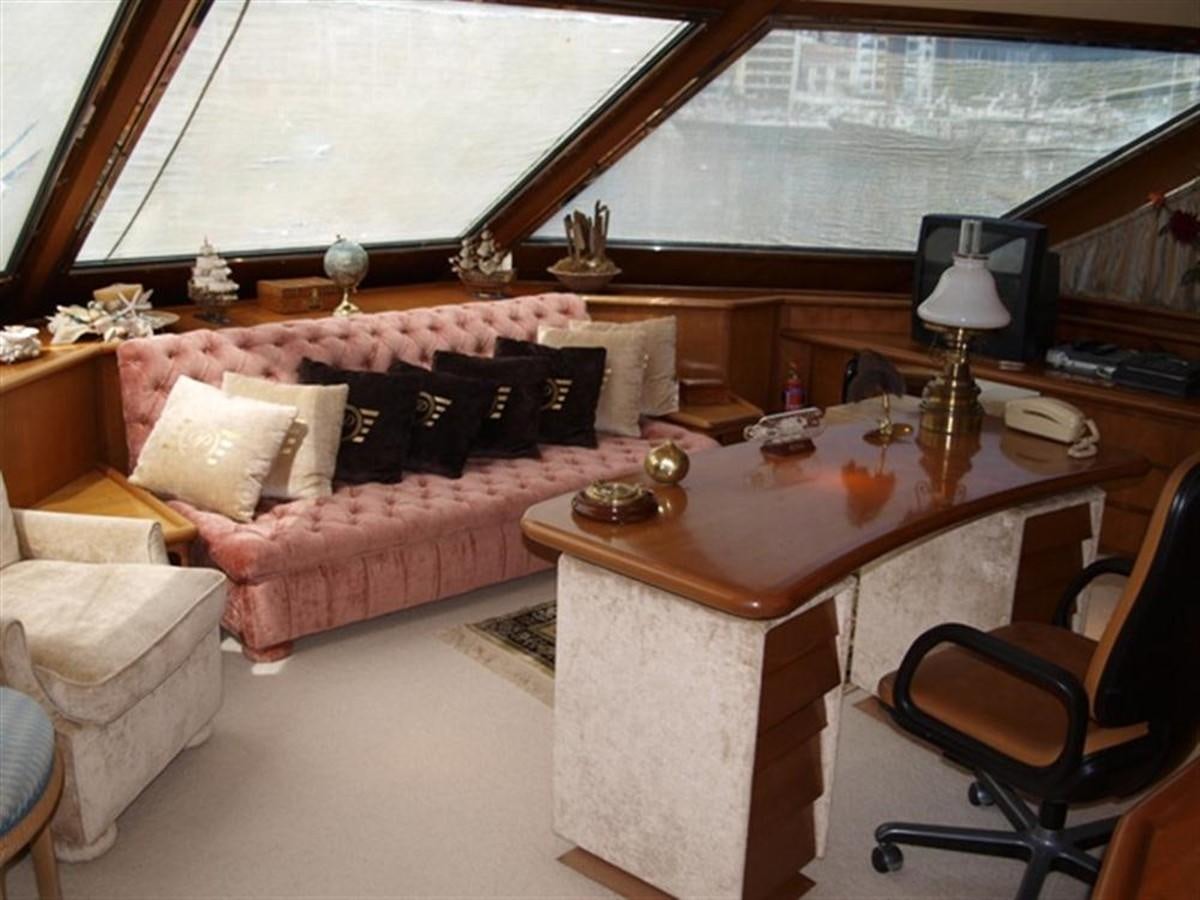 a living room with a couch and a table aboard PARADIS Yacht for Sale
