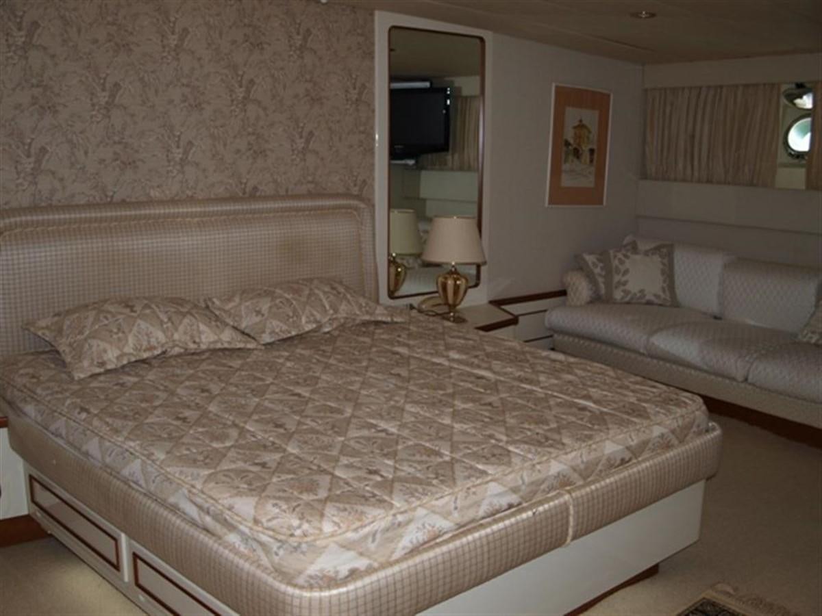 a bed with a white sheet aboard PARADIS Yacht for Sale