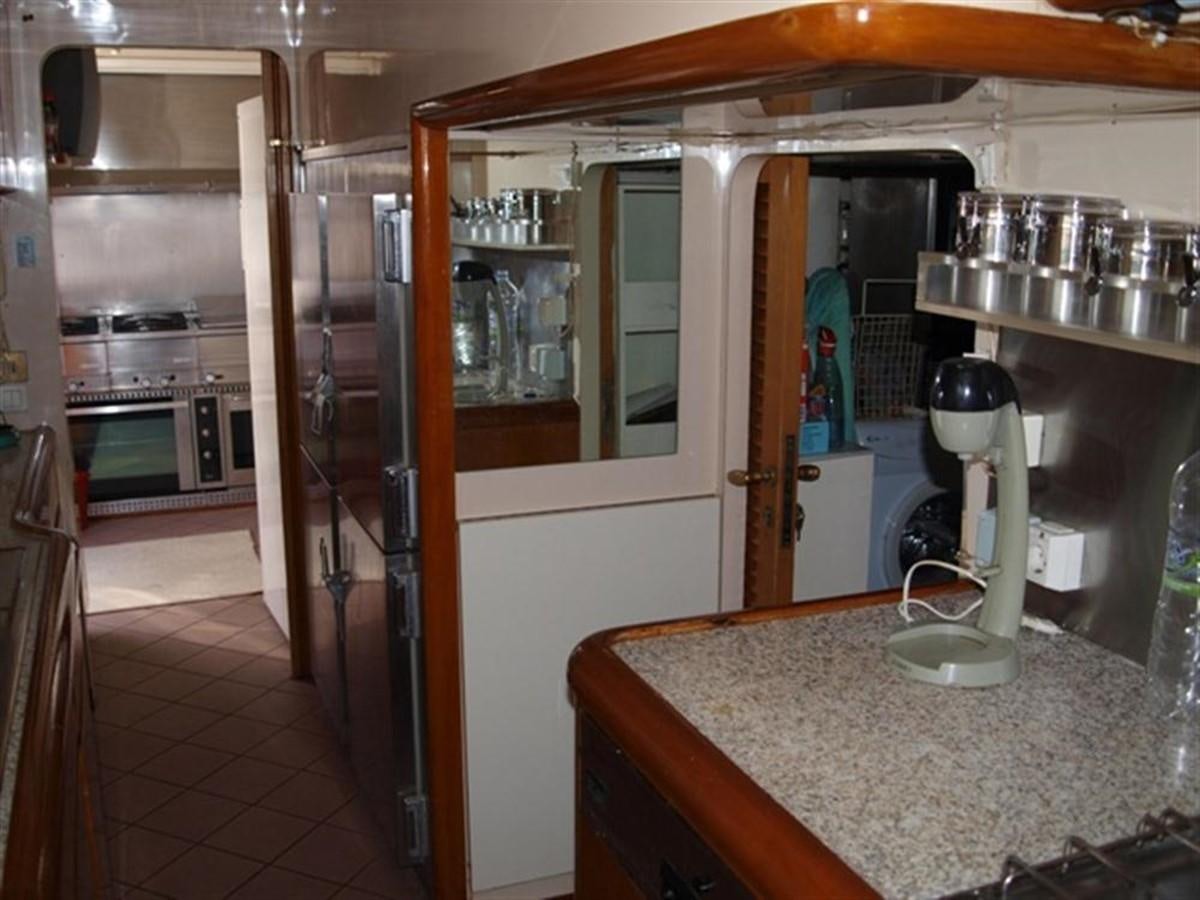 a kitchen with a large glass door aboard PARADIS Yacht for Sale
