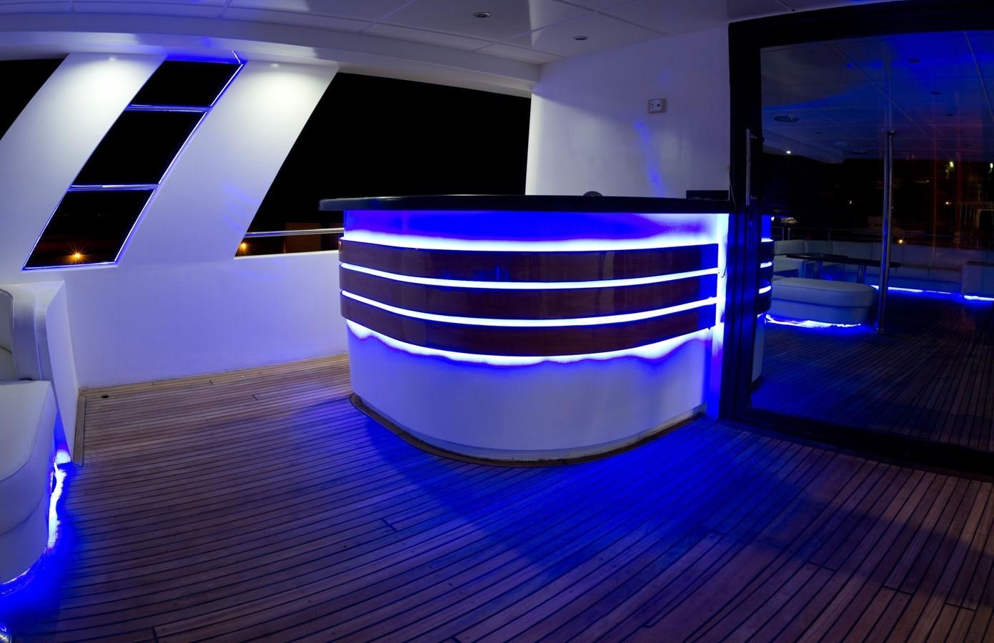 a large purple rectangular object on a wooden surface aboard BETELGUESER Yacht for Sale