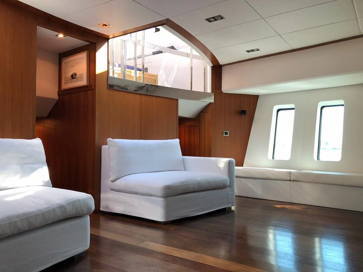 a living room with a wood floor aboard GINEVRA Yacht for Charter