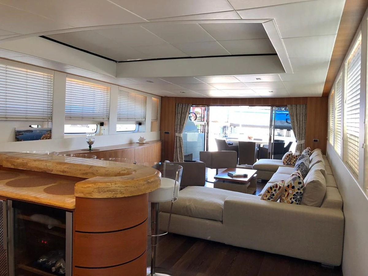 a living room with a couch and a table aboard GINEVRA Yacht for Charter