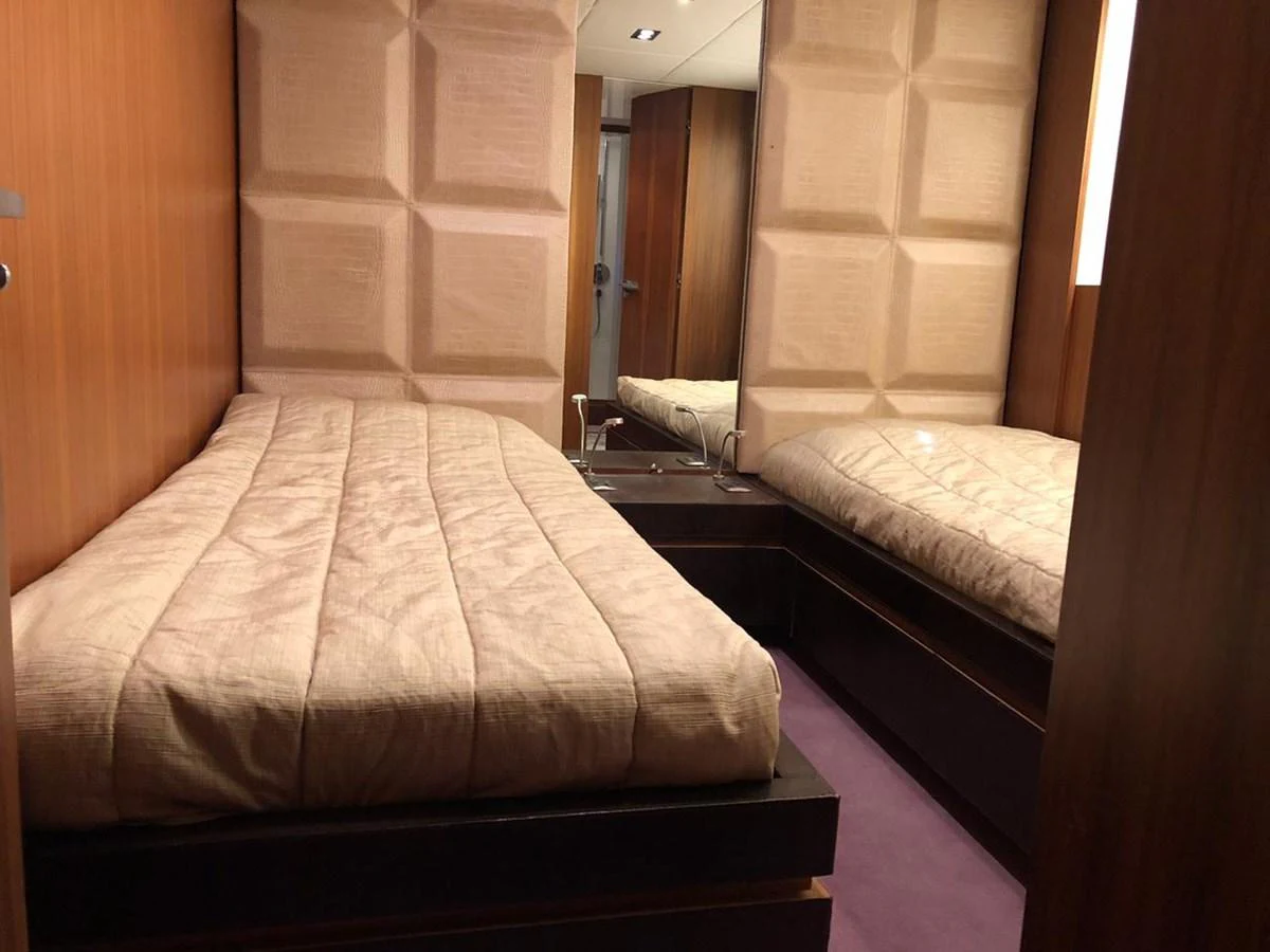 a couple of beds in a hotel room aboard GINEVRA Yacht for Charter