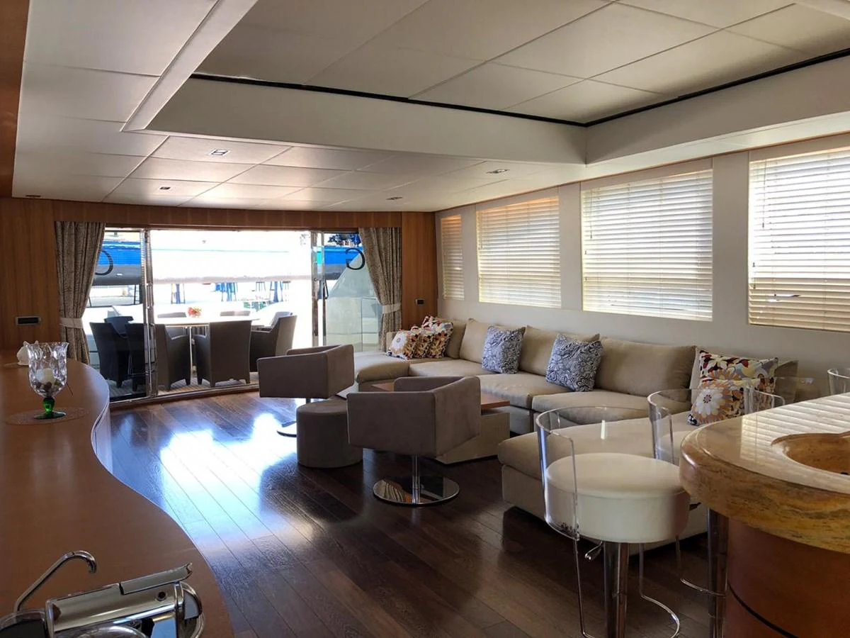 a living room with a large window aboard GINEVRA Yacht for Charter