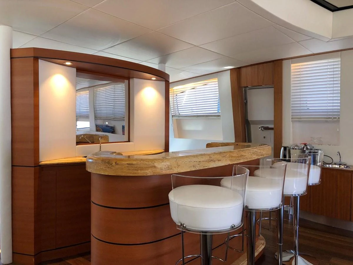 a kitchen with a table and chairs aboard GINEVRA Yacht for Charter
