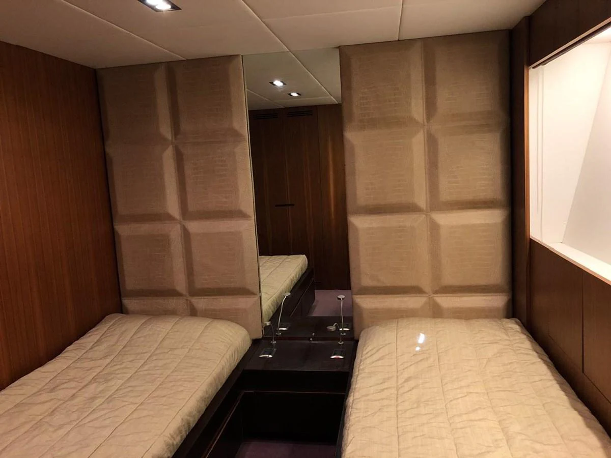 a room with a bed and a desk aboard GINEVRA Yacht for Charter