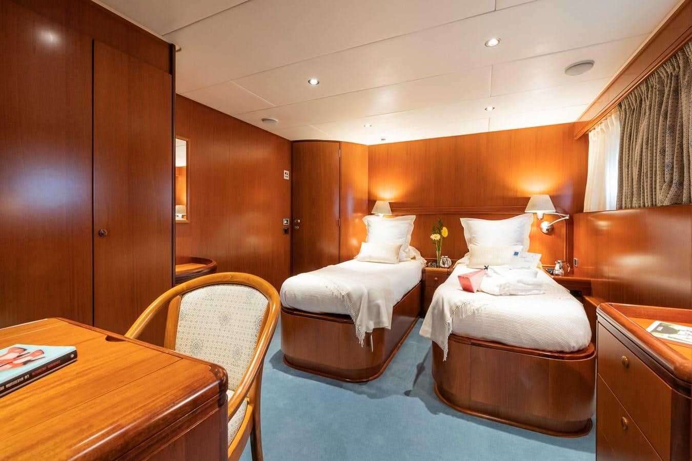 a room with a couple of beds aboard ALCOR Yacht for Charter