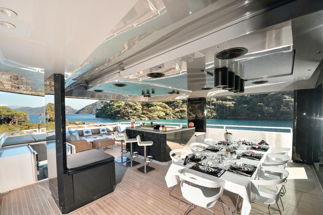 a room with a table and chairs aboard SUN Yacht for Sale