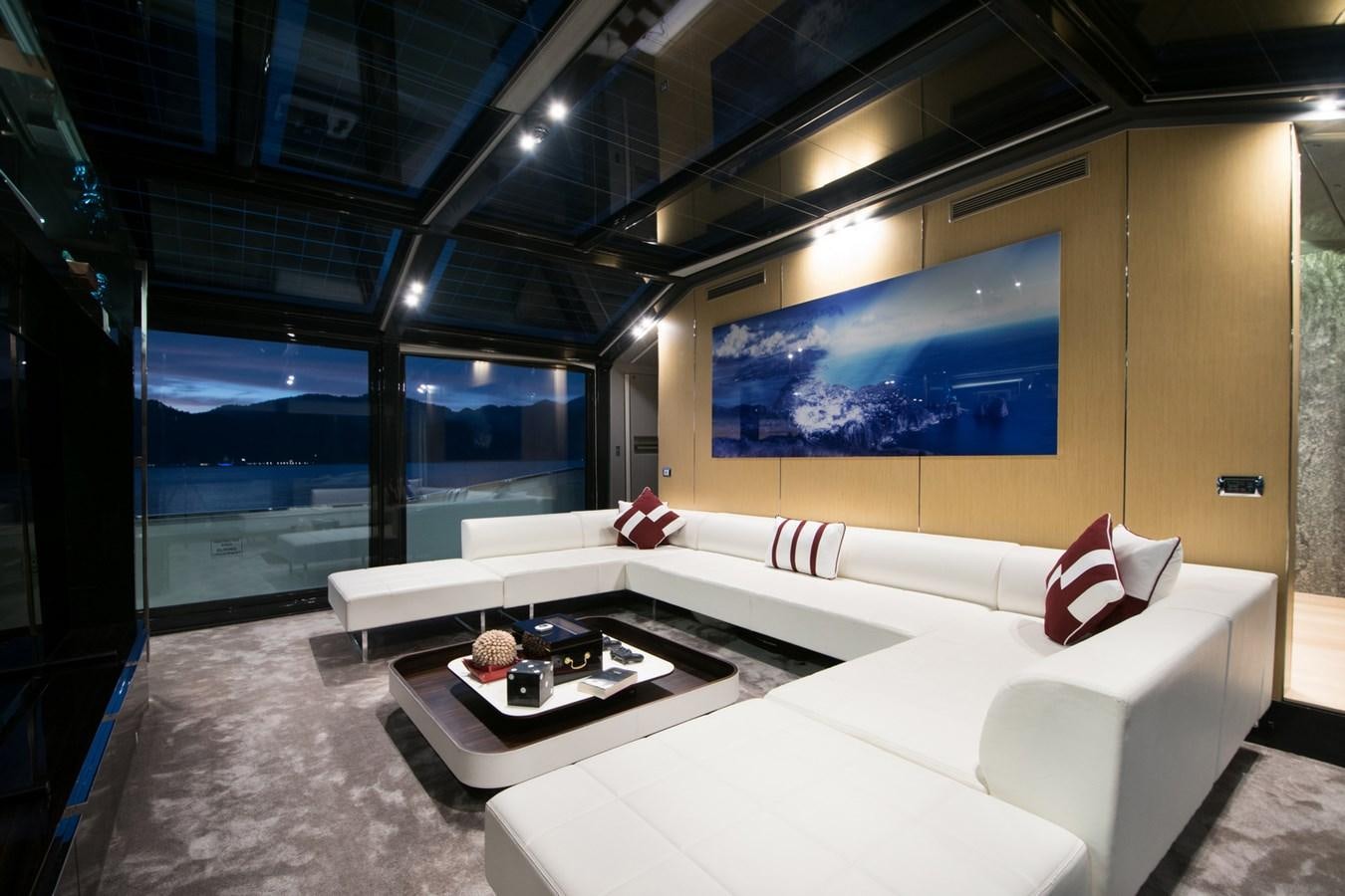 a room with a couch and a table aboard SUN Yacht for Sale