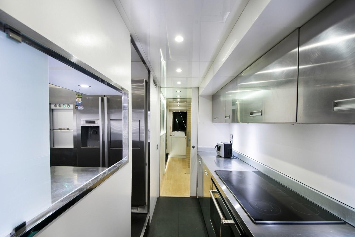 a large kitchen with stainless steel appliances aboard SUN Yacht for Sale