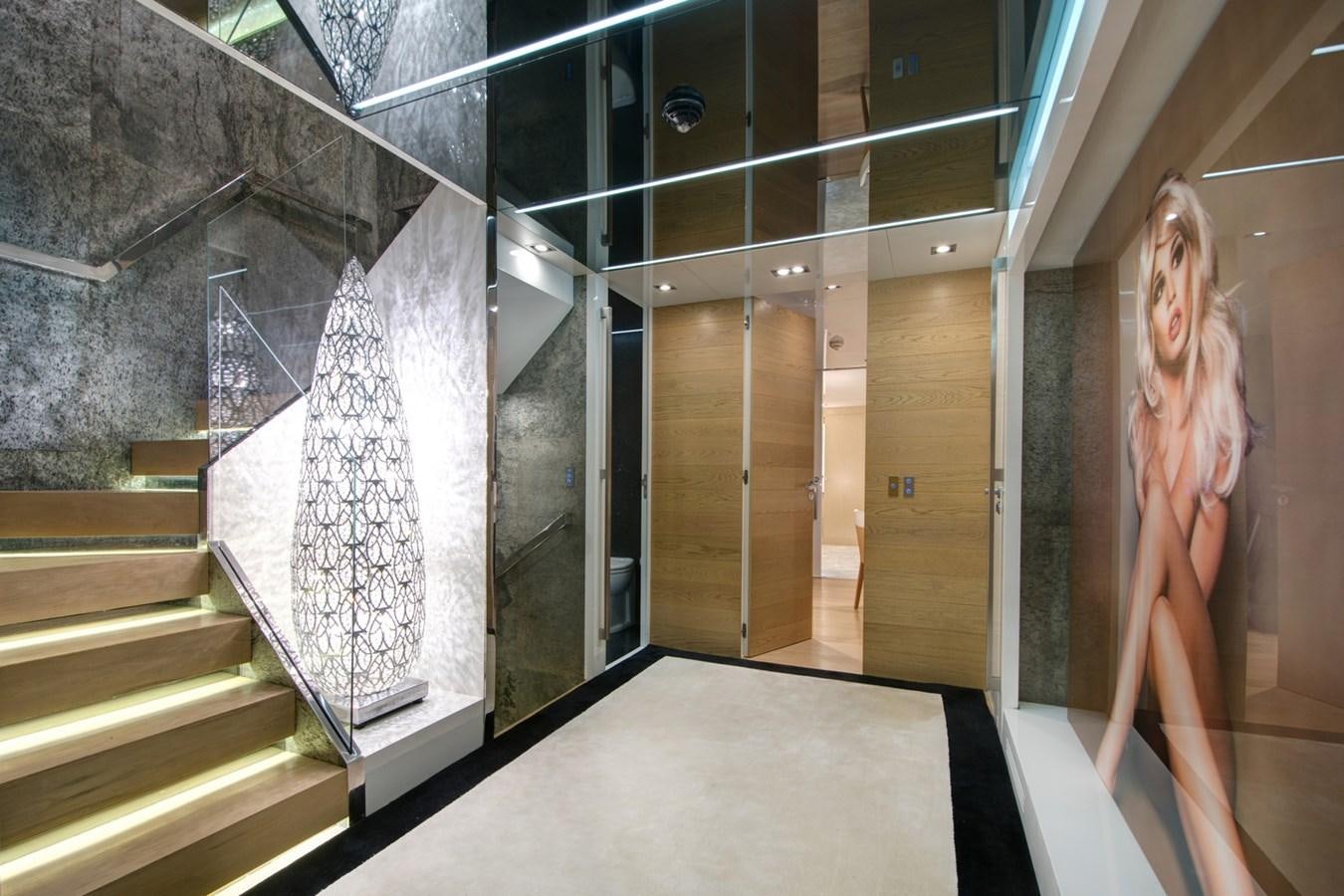 a room with a staircase and a wall with glass walls aboard SUN Yacht for Sale