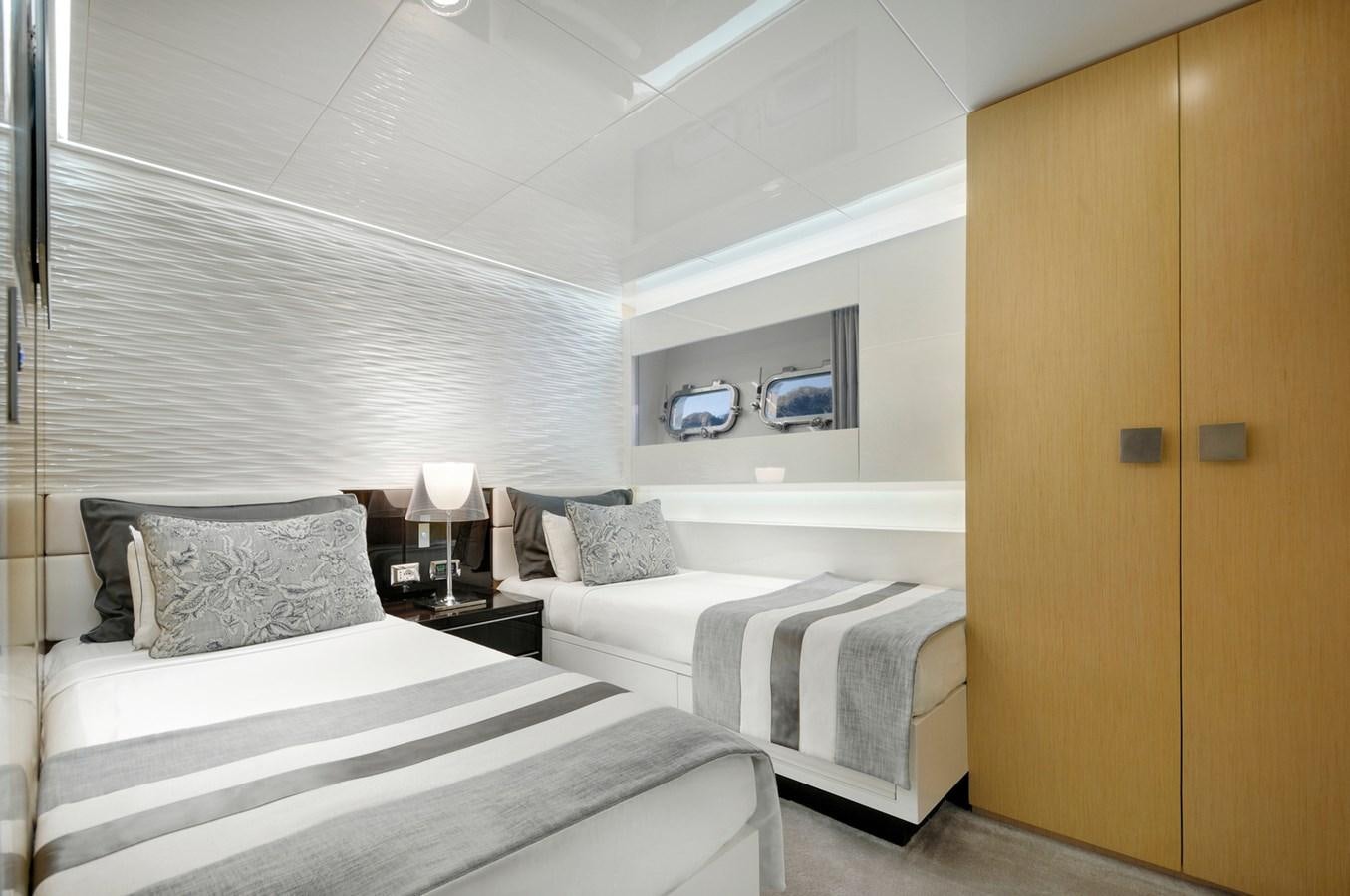a couple of beds in a room aboard SUN Yacht for Sale