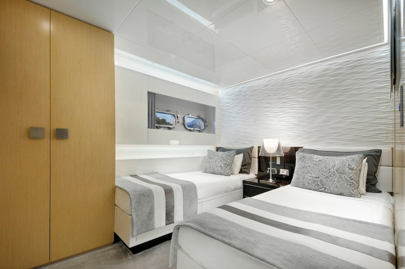 a couple of beds in a room aboard SUN Yacht for Sale