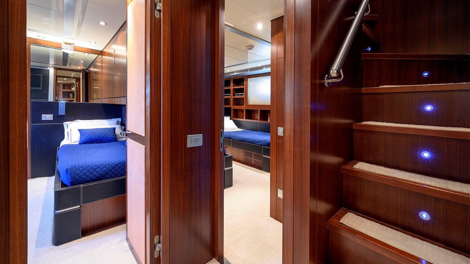 a room with a bed and a closet aboard BEYOND Yacht for Sale