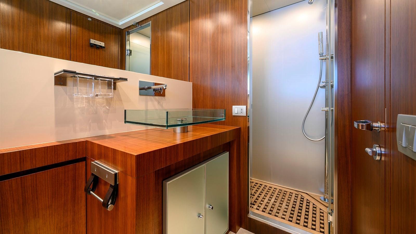 a kitchen with wooden cabinets aboard BEYOND Yacht for Sale