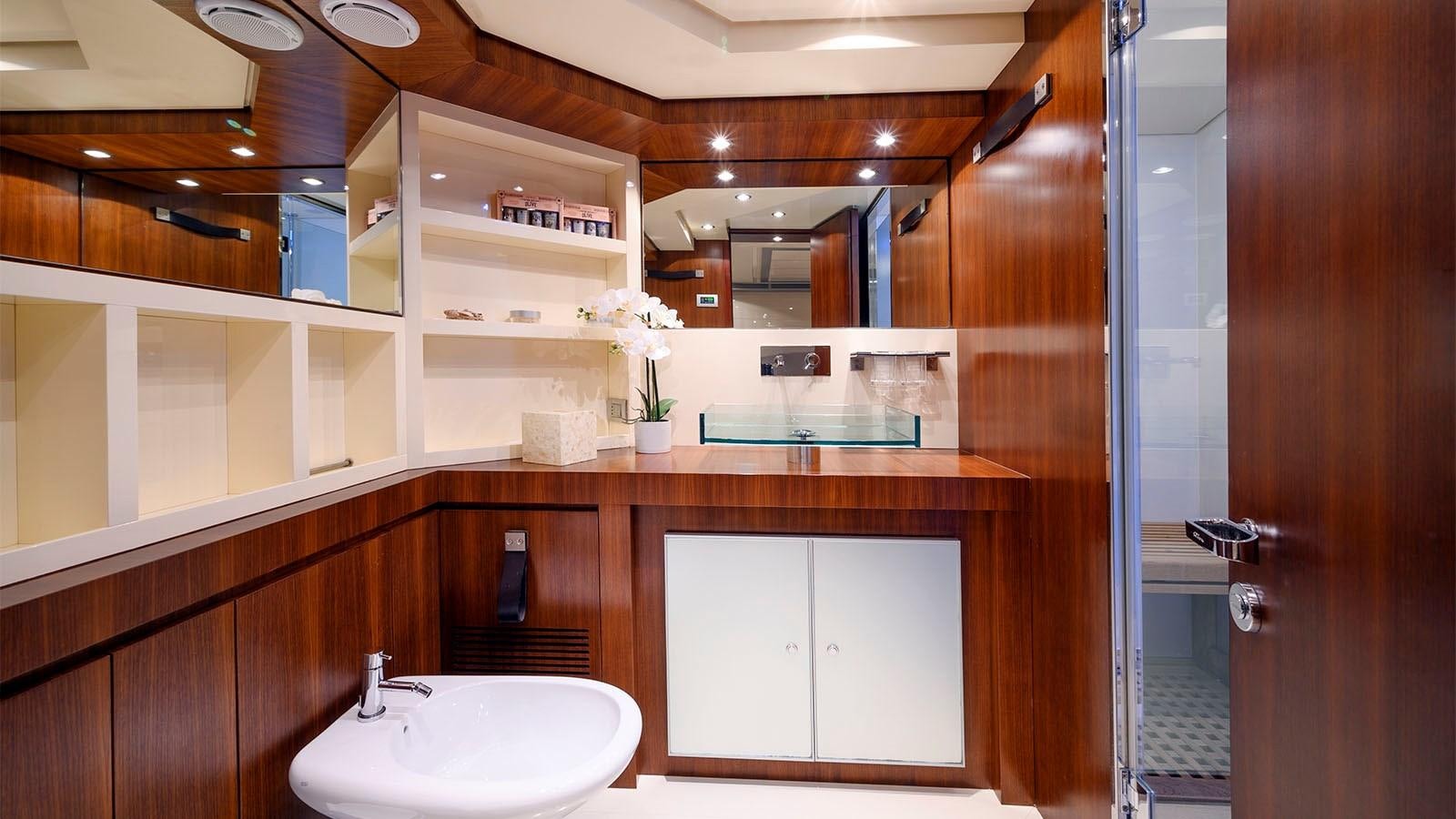 a bathroom with a sink and cabinets aboard BEYOND Yacht for Sale