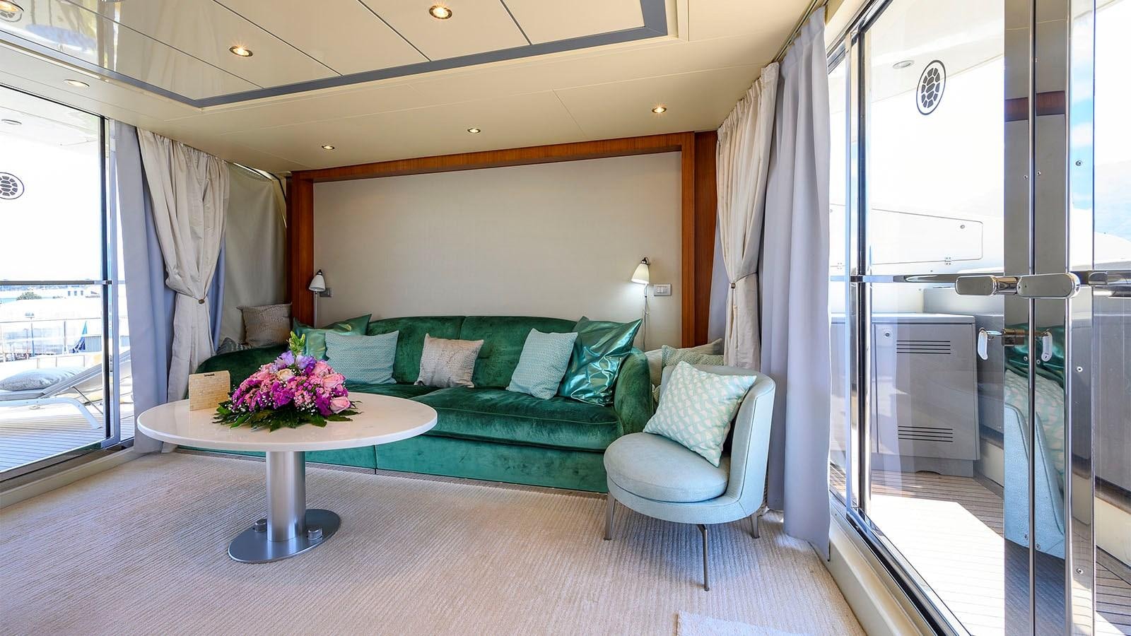 a living room with a couch and a table aboard BEYOND Yacht for Sale