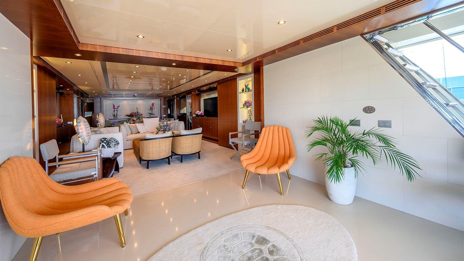 a large room with chairs and a table aboard BEYOND Yacht for Sale