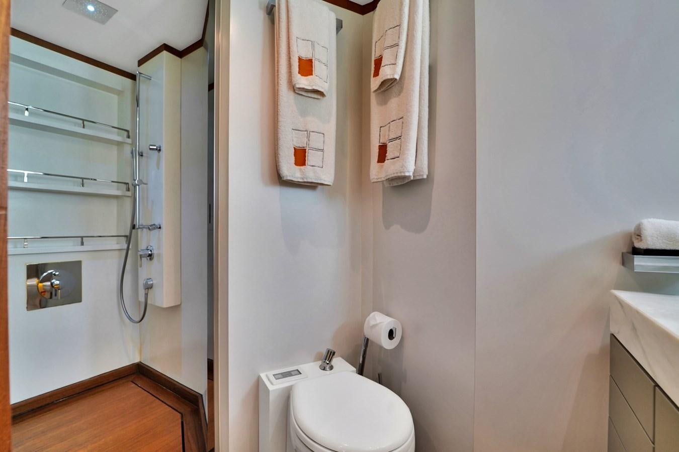 a bathroom with a toilet and a sink aboard DIAMOND Yacht for Sale